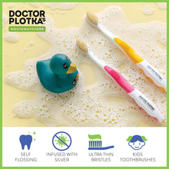Close-up of dual-layer flossing bristles on pink toothbrush