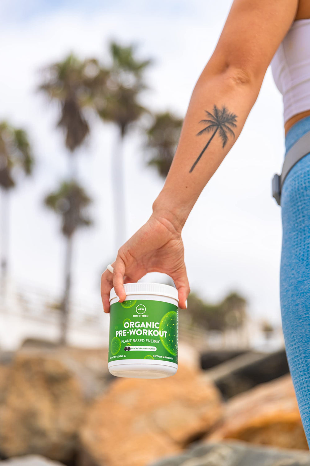 MRM Black Cherry flavor pre-workout powder ready to mix at home gym.