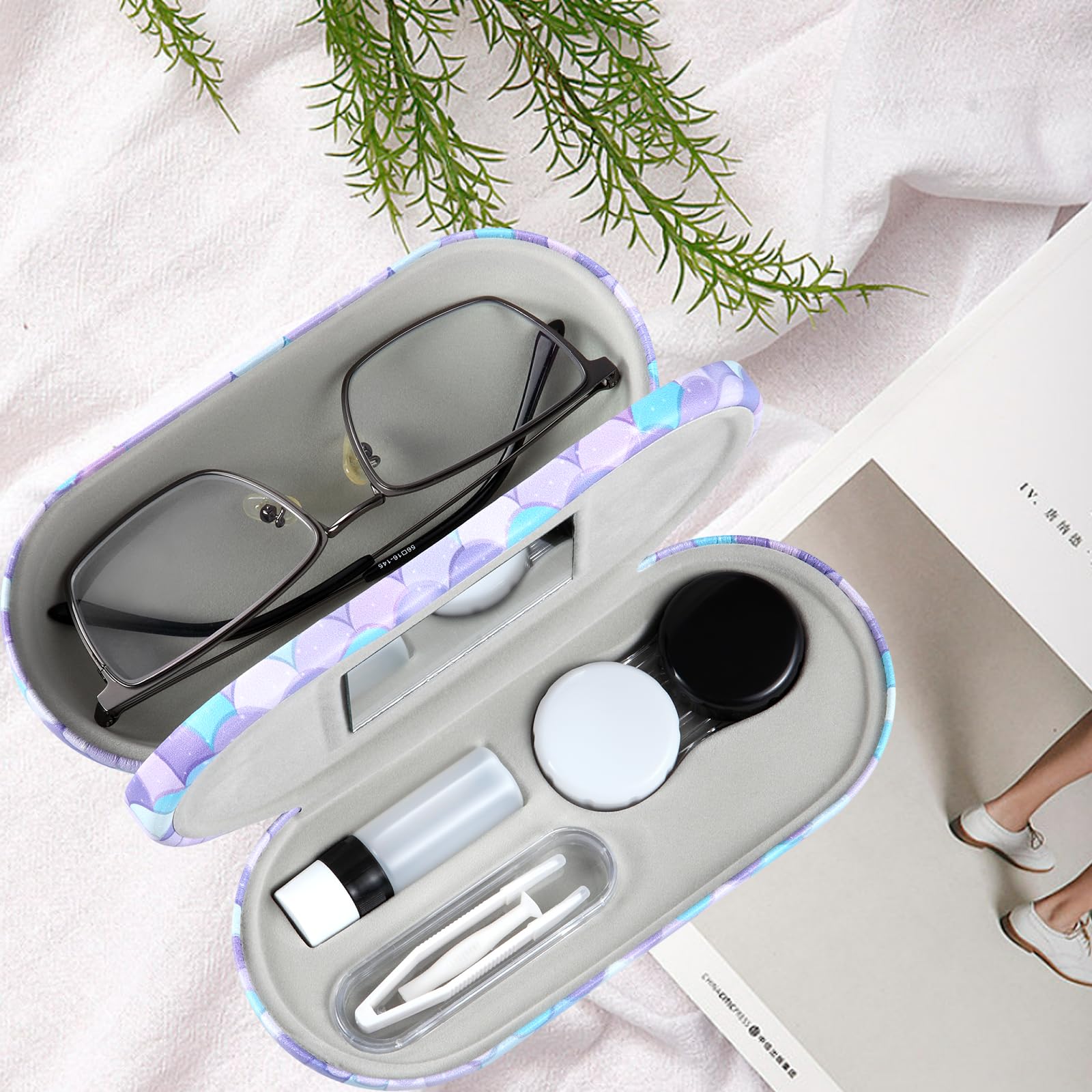 Double-sided lens case opened showing storage compartments