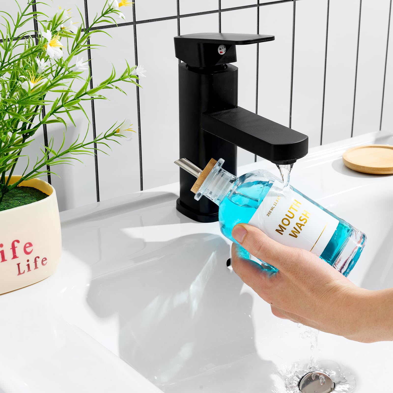 Multi-purpose mouthwash dispenser shown in bathroom setup