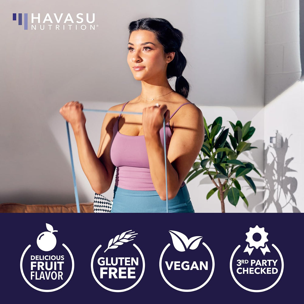 Daily-use mixed berry gummies next to a glass of water