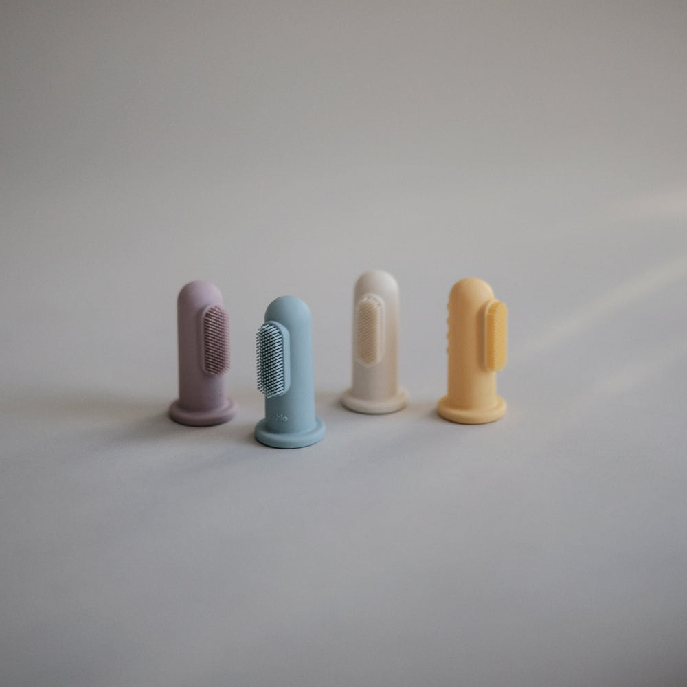 Close-up of soft silicone bristles on Mushie finger toothbrush
