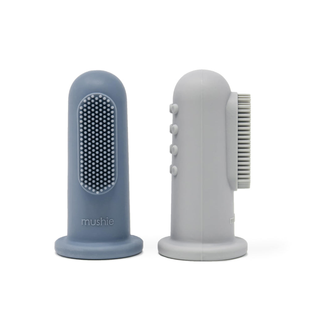 Mushie baby finger toothbrush Tradewinds and Stone colors on hand