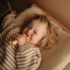Close-up of soft bristles on Mushie Flower toddler toothbrush