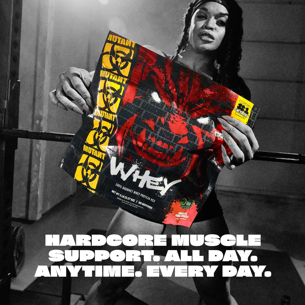 Scoop of Mutant Whey Vanilla Ice Cream being added to a glass