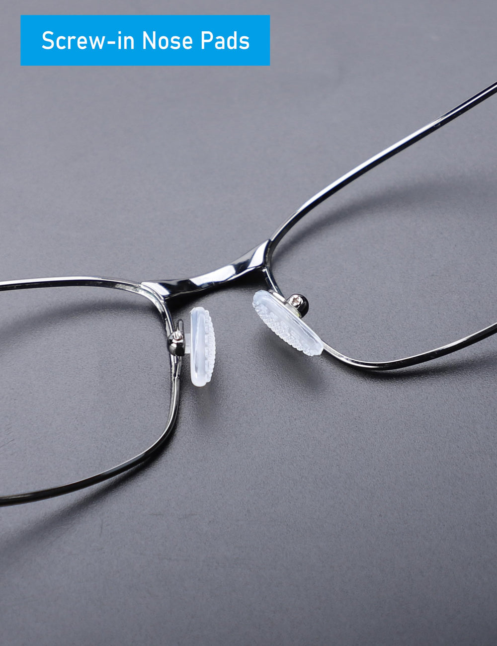 Nose pads being installed into eyeglasses frame with screwdriver