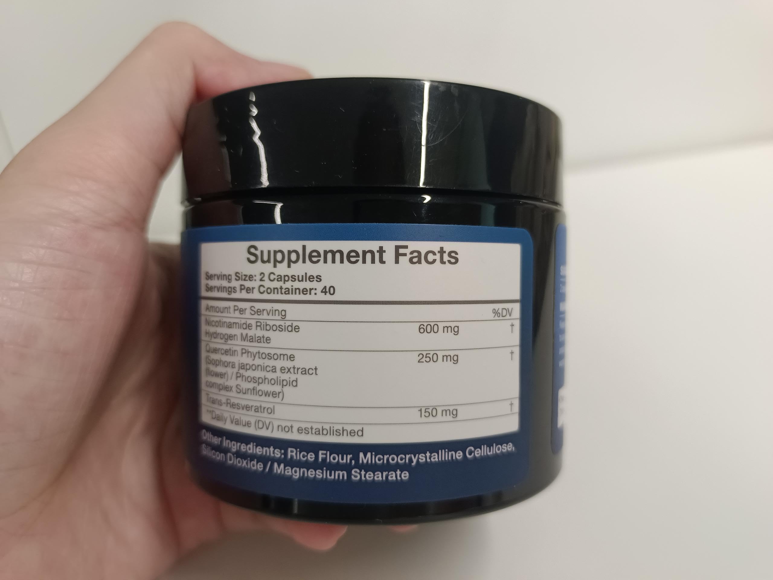 Packaging display of 80-capsule NAD+ supplement bottle