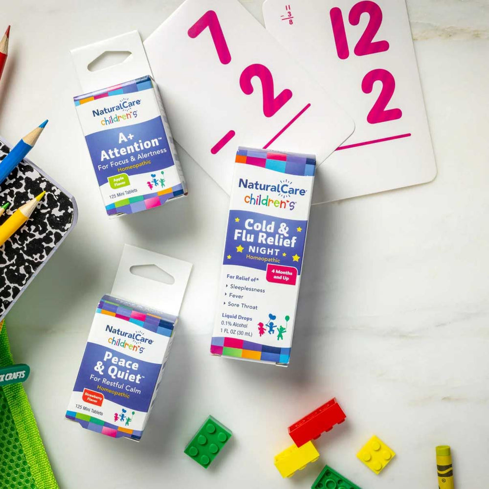 NaturalCare bottle inside a child's backpack suggesting on-the-go convenience