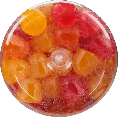 Gummies arranged with fruit slices