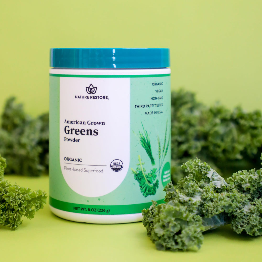 Close-up of greens powder in a scoop