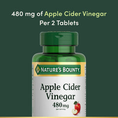 Nature's Bounty tablet in hand to show size and portability for on-the-go convenience