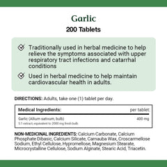 Garlic tablets arranged next to Nature's Bounty bottle