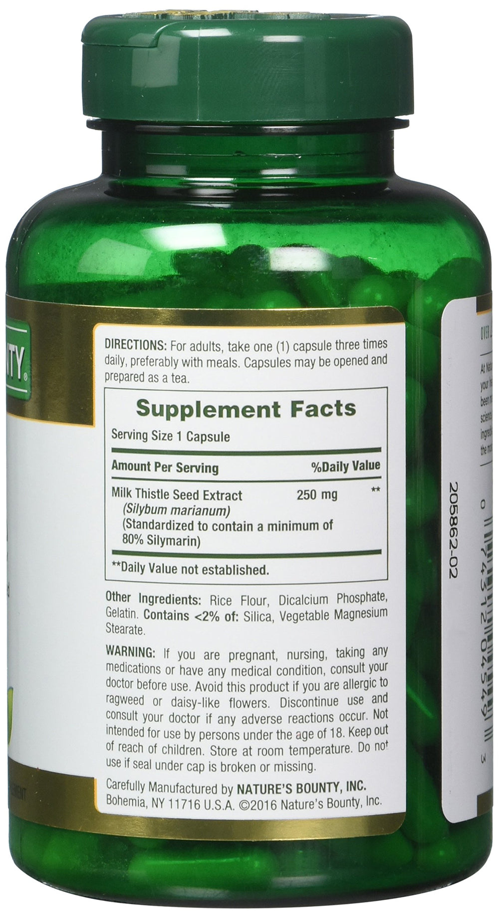 Close-up of milk thistle capsules inside the bottle