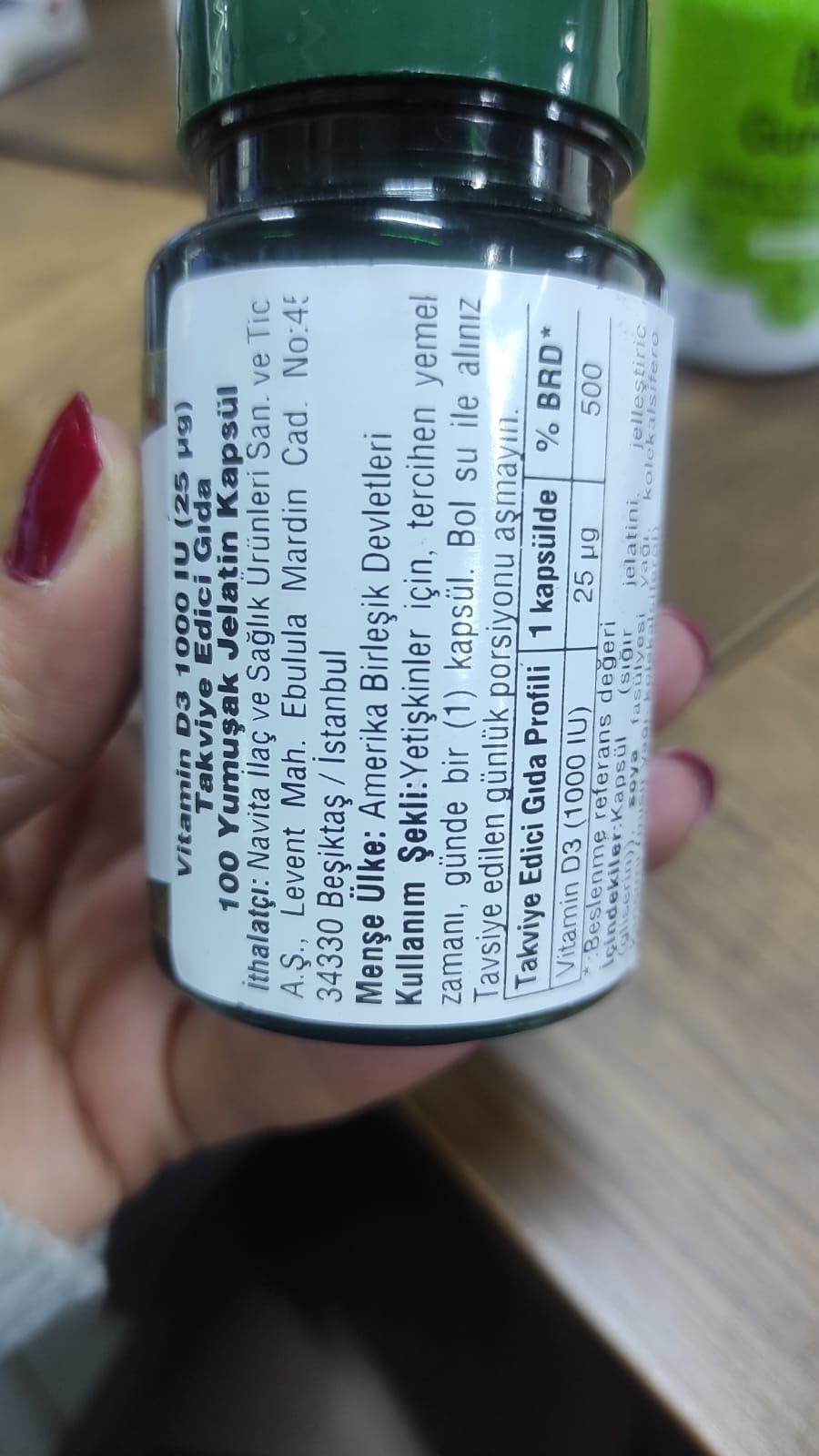 Soft gels being poured from Nature's Bounty bottle for convenient daily sun vitamin