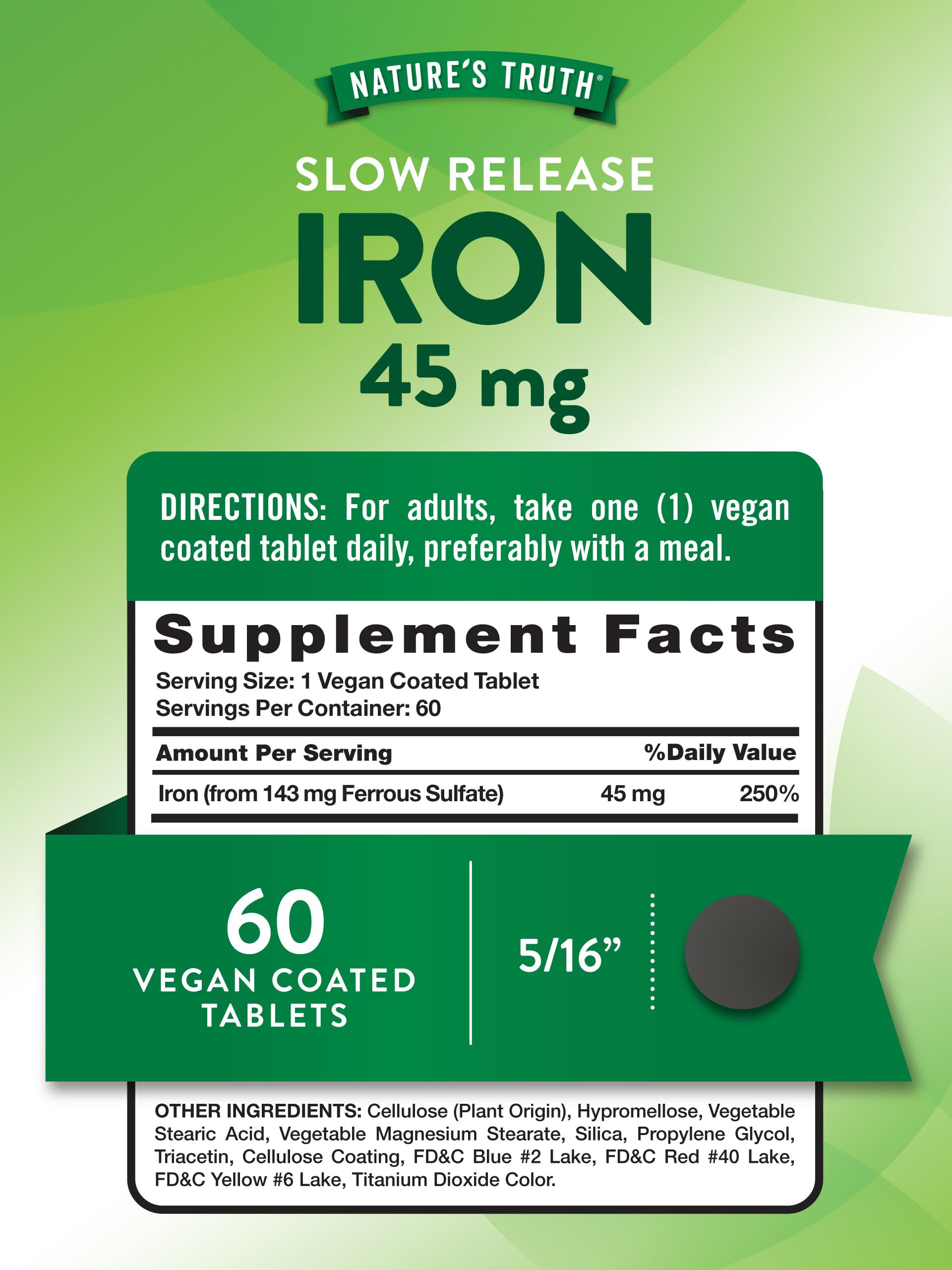 Close-up of iron supplement bottle and vegan coated tablets