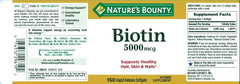 Close-up of Nature's Bounty Biotin 5000 mcg softgel bottle label