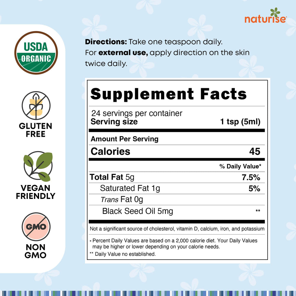 Close-up of cold-pressed Nigella sativa oil in glass bottle