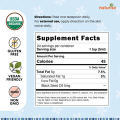 Close-up of cold-pressed Nigella sativa oil in glass bottle