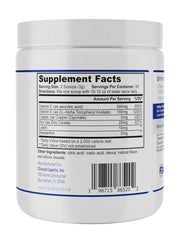 Powder being scooped into a glass of water