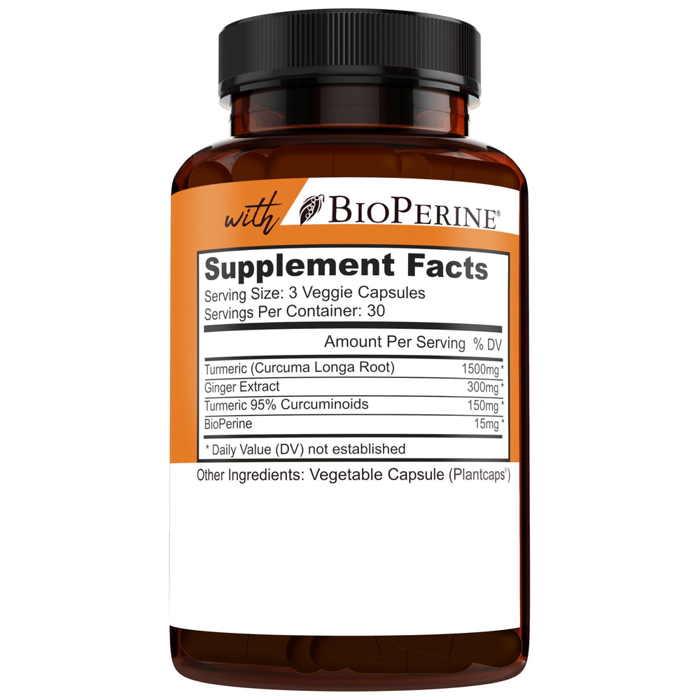 Natural turmeric root and capsules on white background