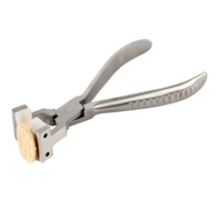 NIDEK suction cup plier eyeglasses repair tool close-up