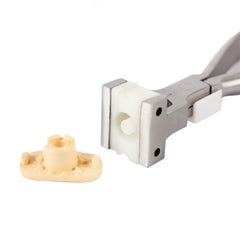 Lens being installed with NIDEK suction cup plier