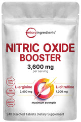Bottle of nitric oxide supplement with bisected tablets