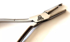 Nose Pad Arm Adjusting Pliers next to eyeglass frame