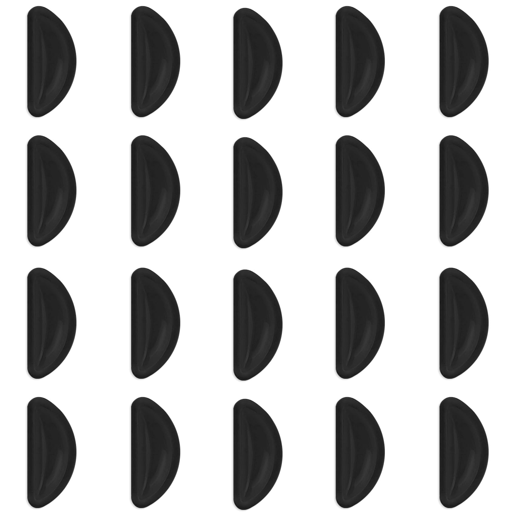 Close-up of black adhesive eyeglass nose pads on glasses