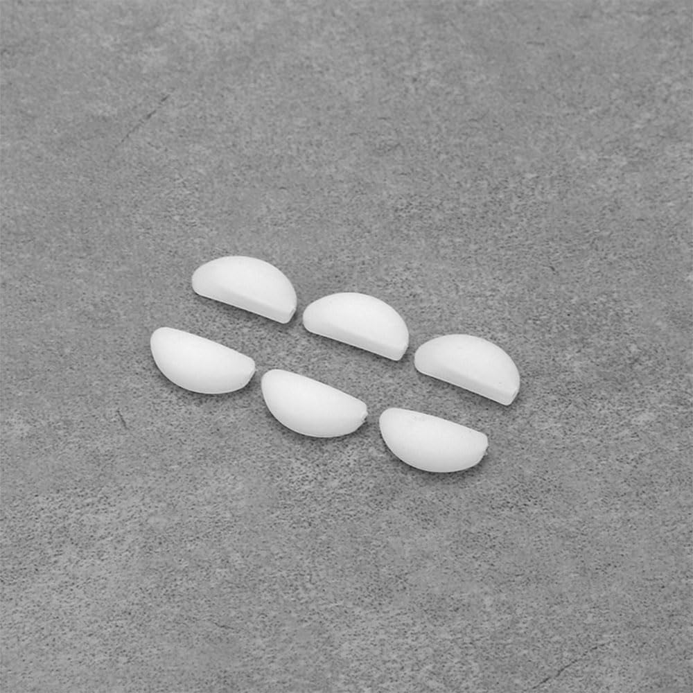 Three pairs of white nose pads for eyewear