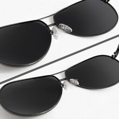 Eyeglasses with replacement nose pads attached