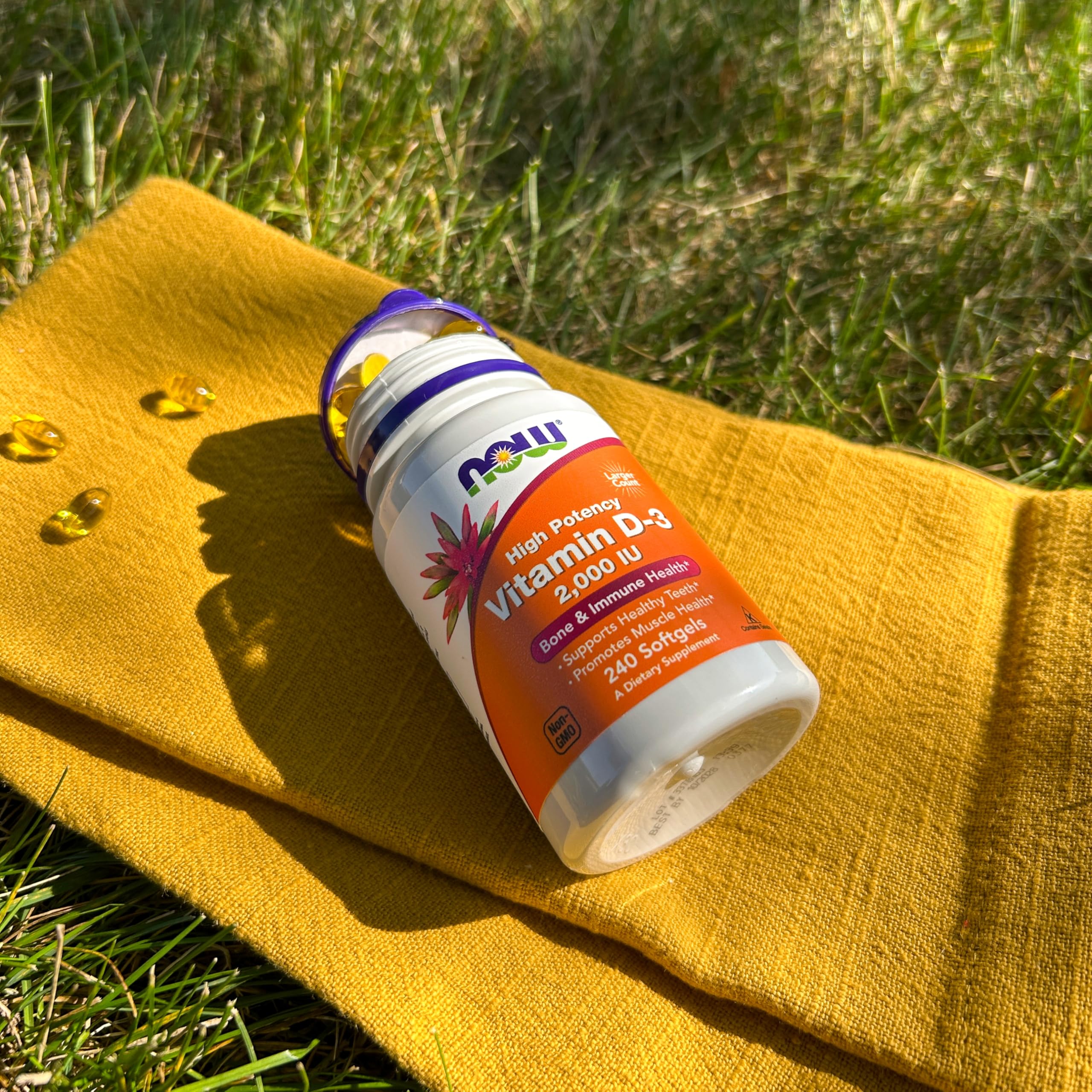 NOW Foods Vitamin D-3 bottle on desk supporting everyday wellness