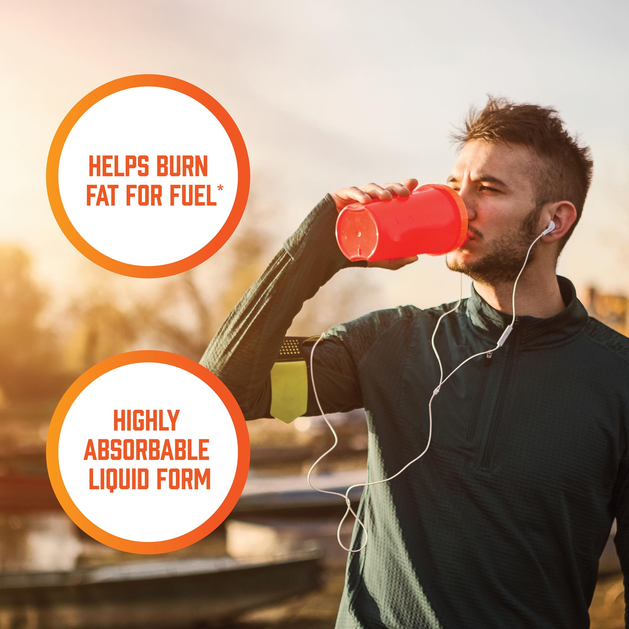 NOW Sports L-Carnitine Liquid tropical punch flavor glass showcases refreshing taste.