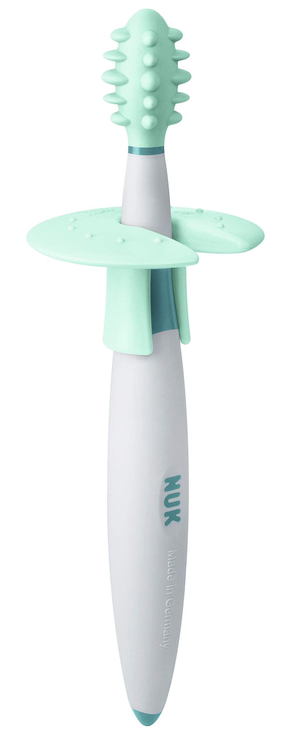 Brush designed to massage gums and palate during teething