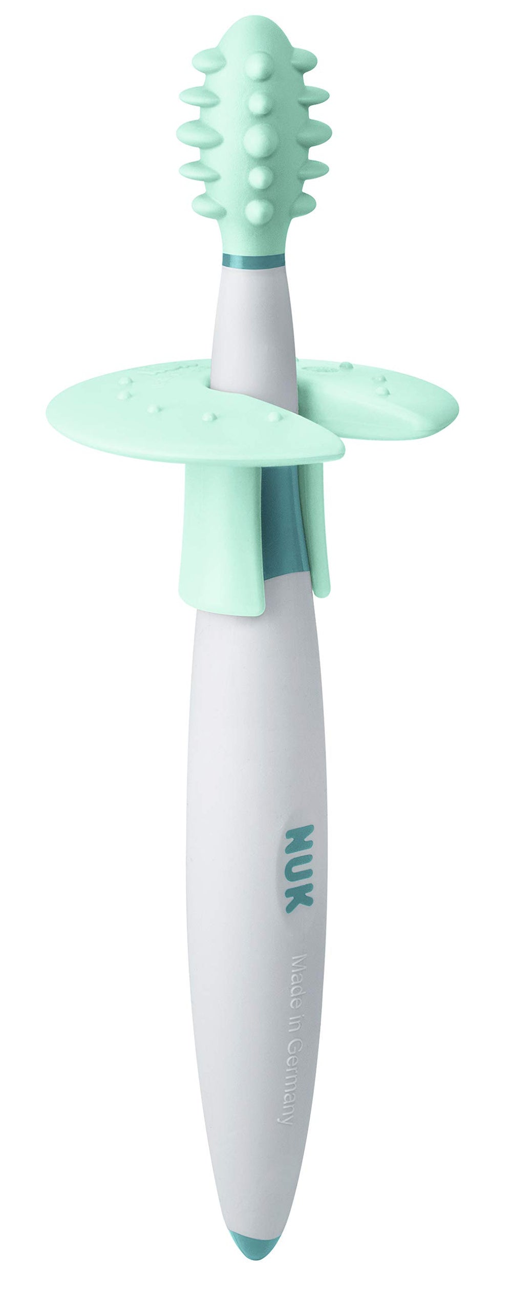 Brush designed to massage gums and palate during teething