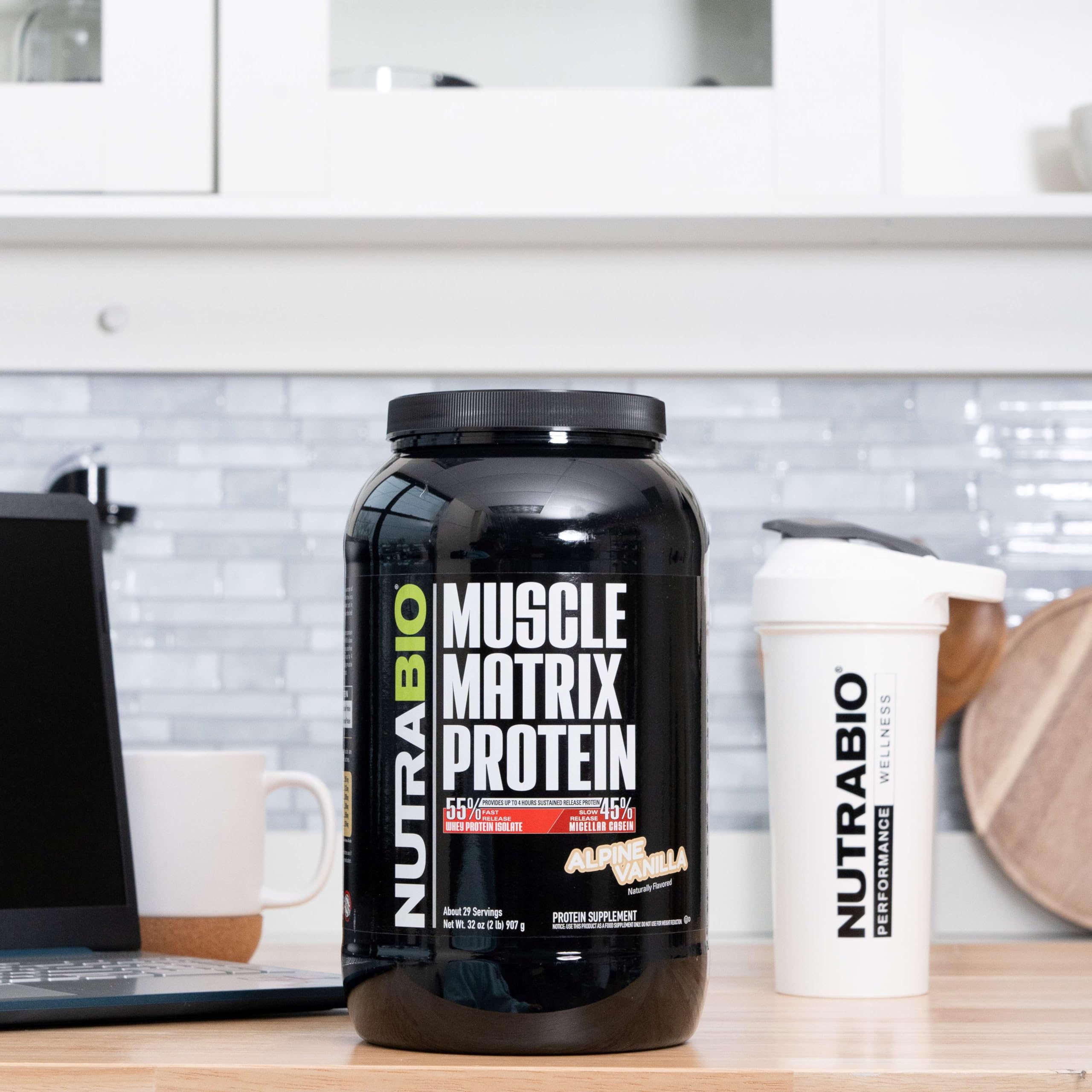 NutraBio Muscle Matrix scoop and jar, convenient serving tool for fast and slow protein release.