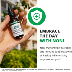 Close-up of NutraMedix Noni Drops tincture bottle