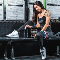 Scoop of Muscle Infusion with label highlights fast and medium-digesting proteins.