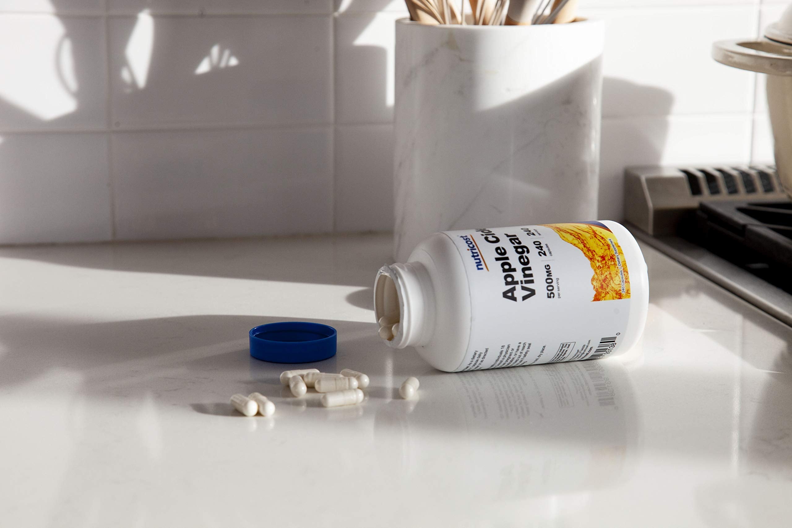 Non-GMO and gluten-free Nutricost ACV Capsules packaging claim