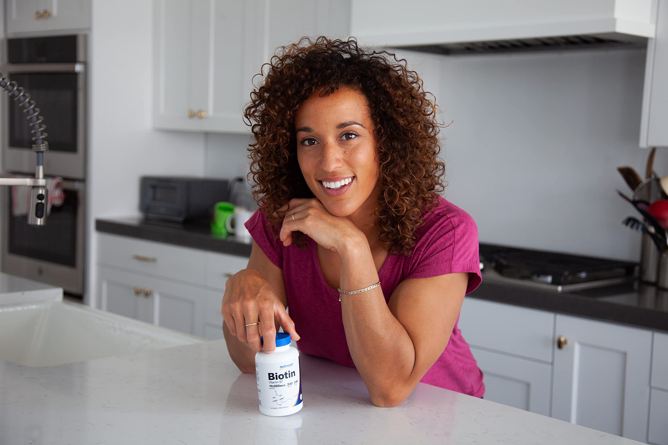 Capsules arranged with bottle for scale