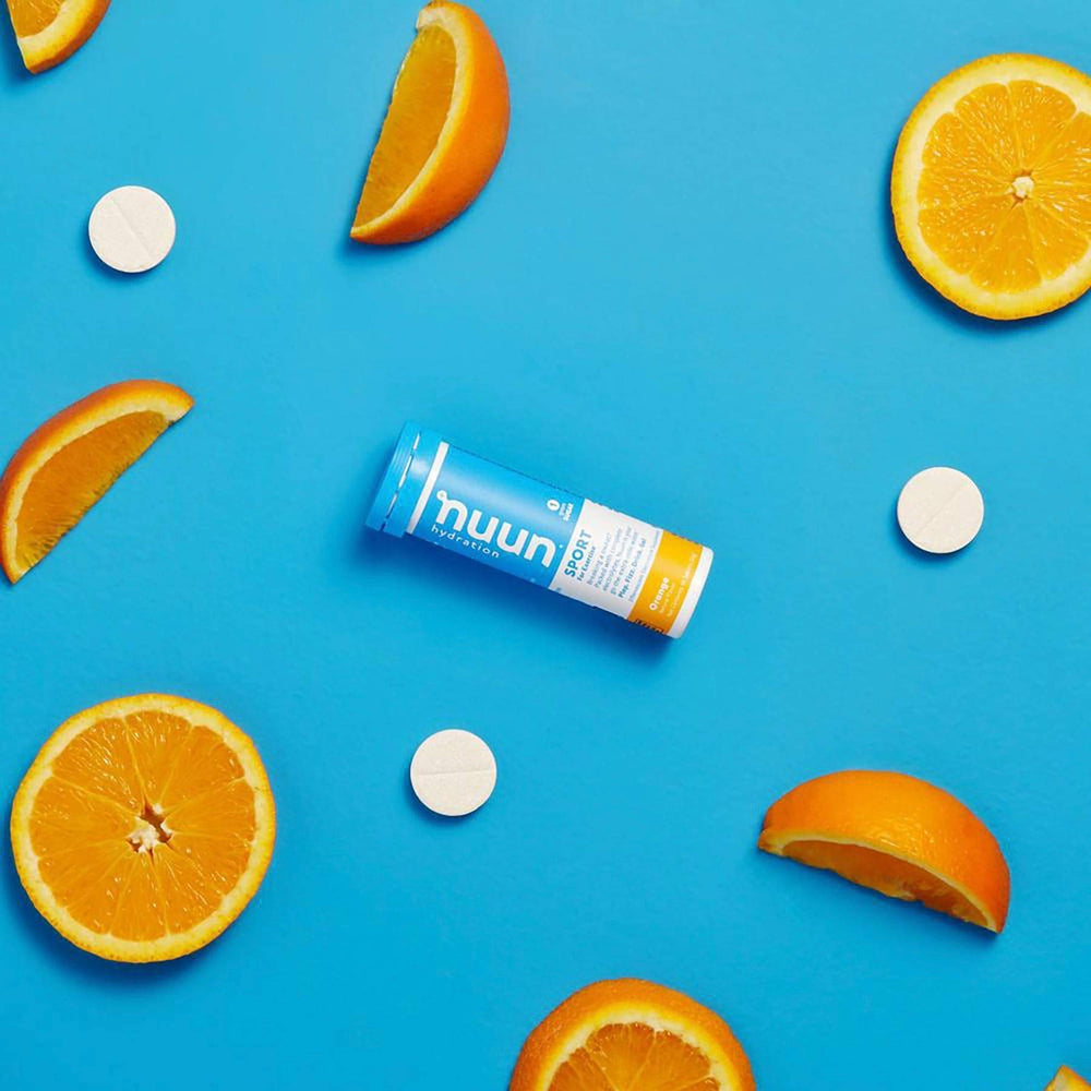 Close-up Nuun Bev Tube Orange tablet showing texture for quick hydration.