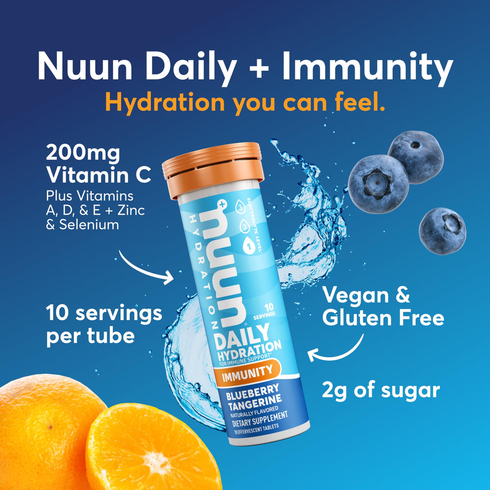 Dissolving Nuun Immunity tablet in water showing fizz