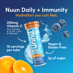 Dissolving Nuun Immunity tablet in water showing fizz