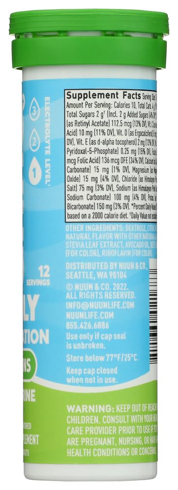 Person pouring Nuun Vitamins Tangerine Lime into a 16oz glass