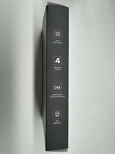 Packaging and included items for the OasiSmile toothbrush