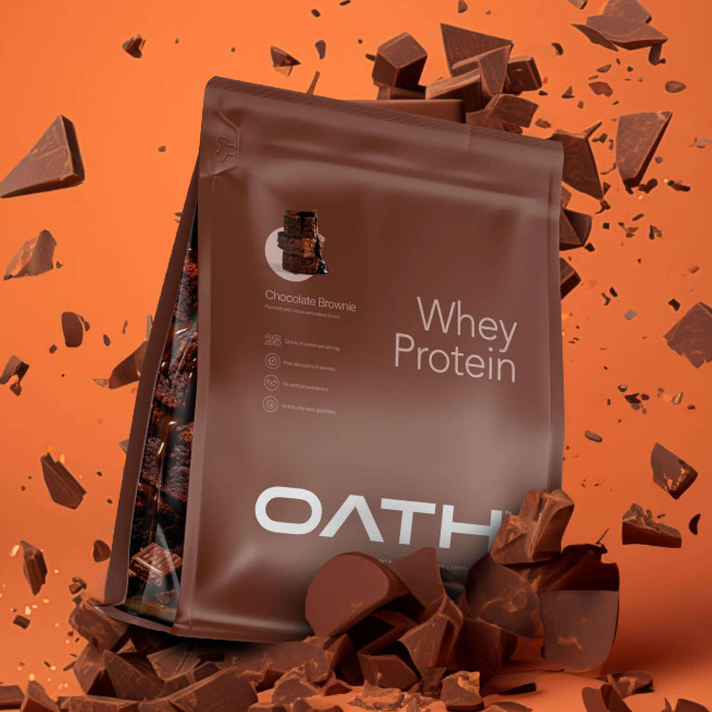 Oath Nutrition whey protein powder Chocolate Brownie glass with creamy shake.