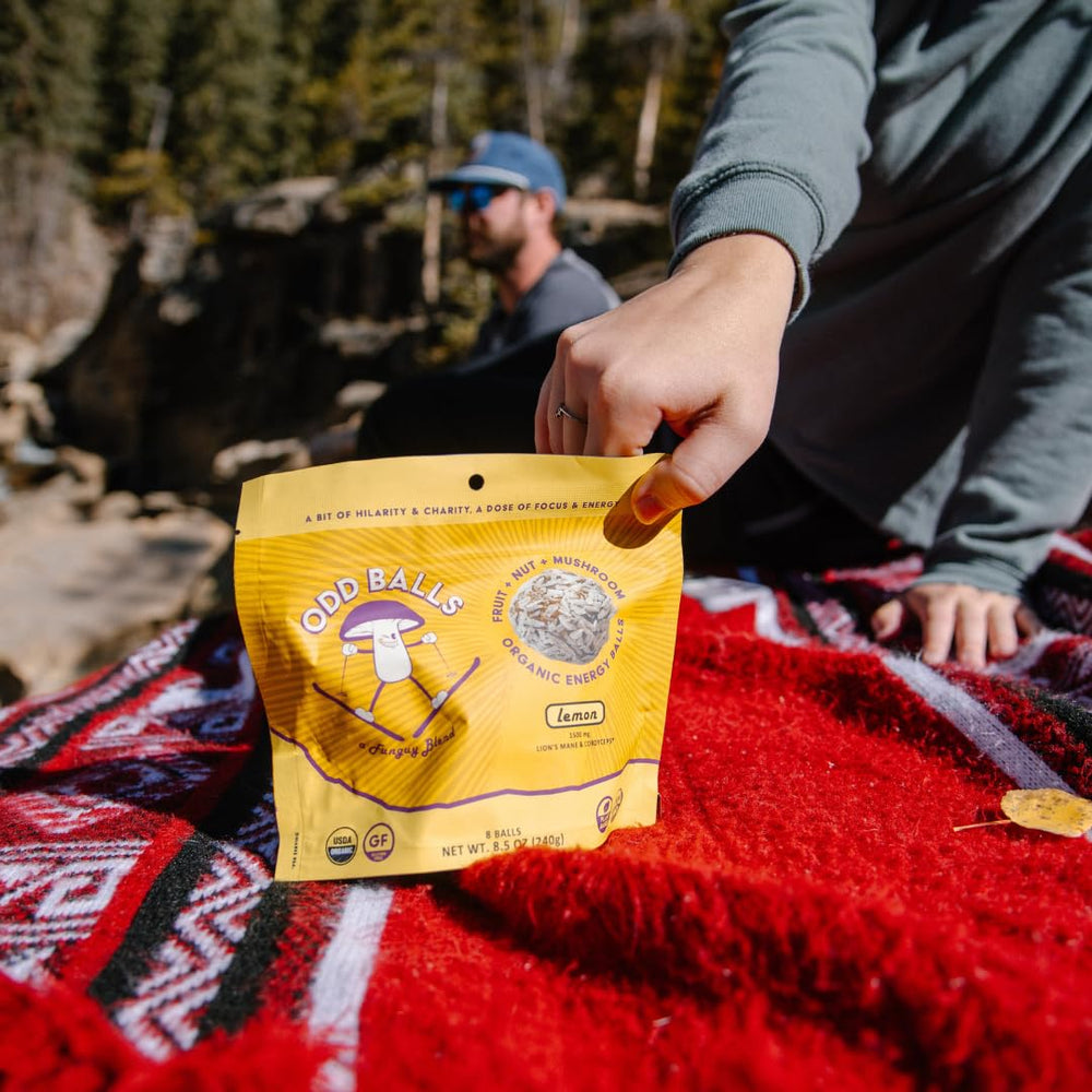 ODD BALLS packaging for Organic Lemon energy balls highlighting organic and vegan claims.