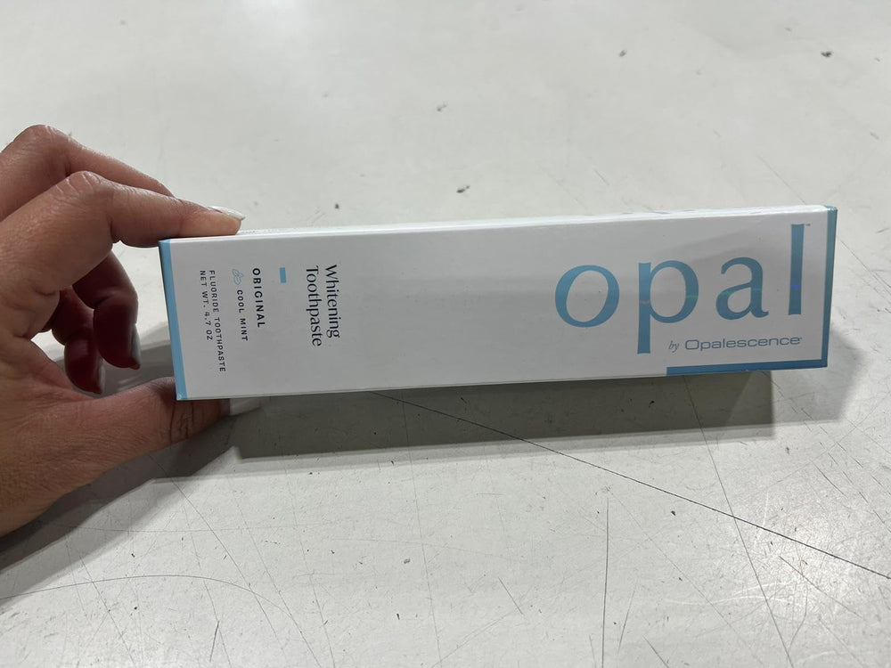 Side view of Opalescence Opal toothpaste pack in display.