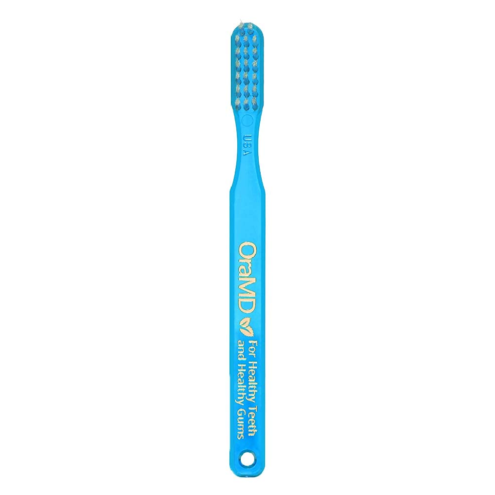 Six-pack OraMD toothbrushes in packaging