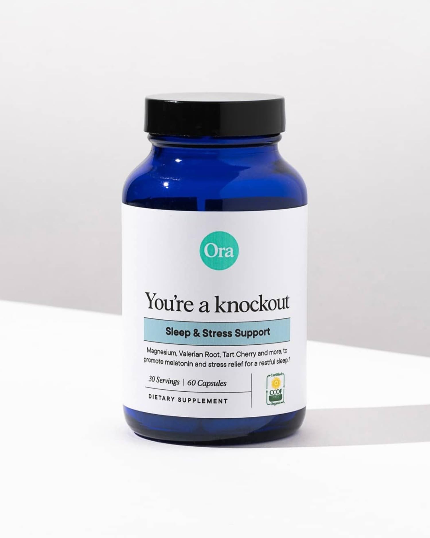 Close-up of Ora Organic Sleep Aid capsule bottle and serving